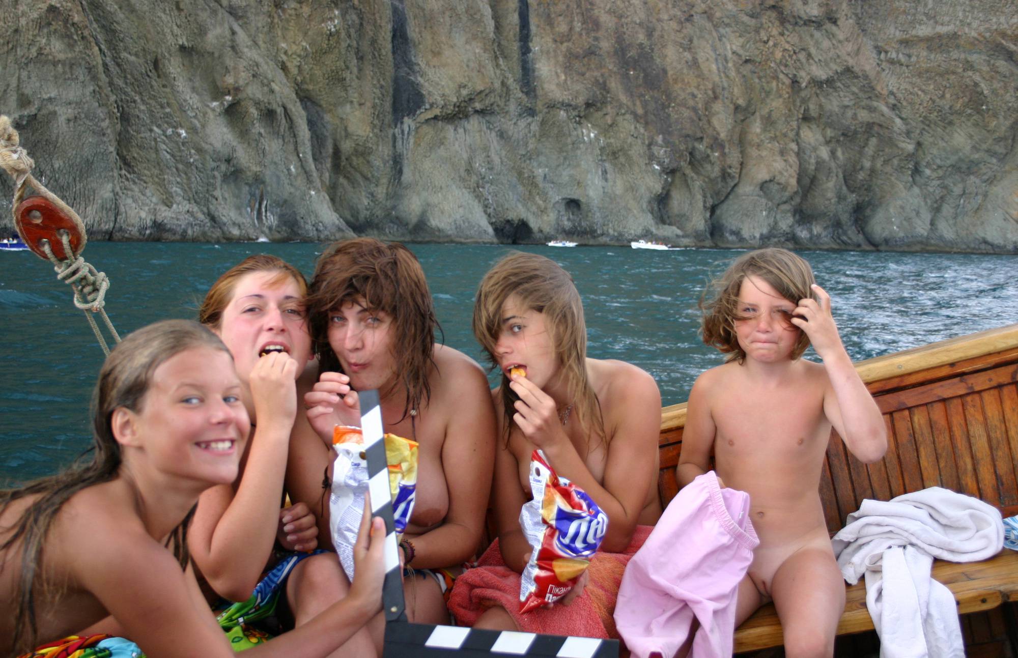 Nudist Pictures Group Snacking on Boat - 2